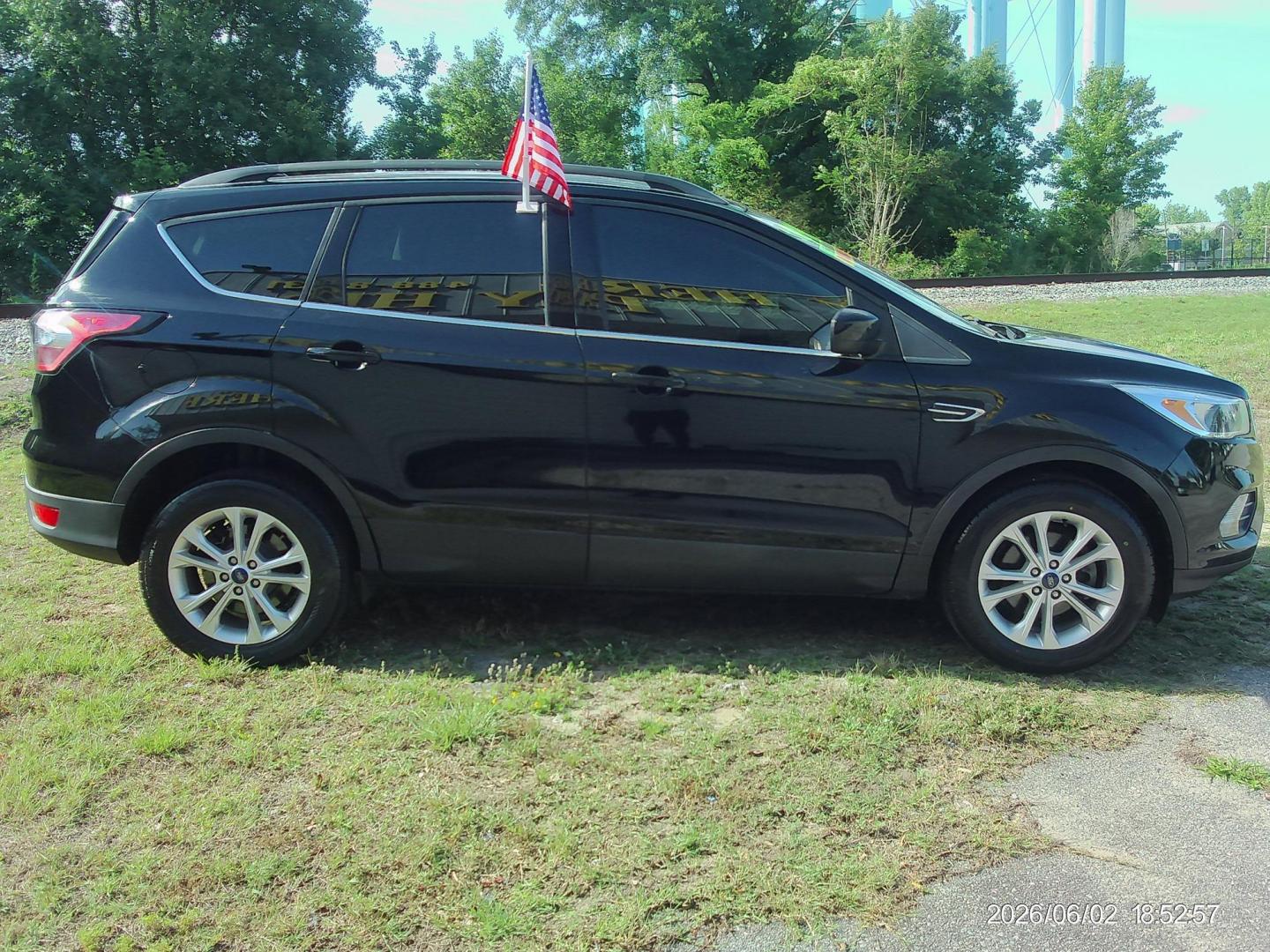 2018 Black Ford Escape SE FWD (1FMCU0GD5JU) with an 1.5L L4 DOHC 16V engine, 6A transmission, located at 2553 Airline Blvd, Portsmouth, VA, 23701, (757) 488-8331, 36.813889, -76.357597 - ***VEHICLE TERMS*** Down Payment: $999 Weekly Payment: $120 APR: 23.9% Repayment Terms: 42 Months *** CALL ELIZABETH SMITH - DIRECTOR OF MARKETING @ 757-488-8331 TO SCHEDULE YOUR APPOINTMENT TODAY AND GET PRE-APPROVED RIGHT OVER THE PHONE*** - Photo#4