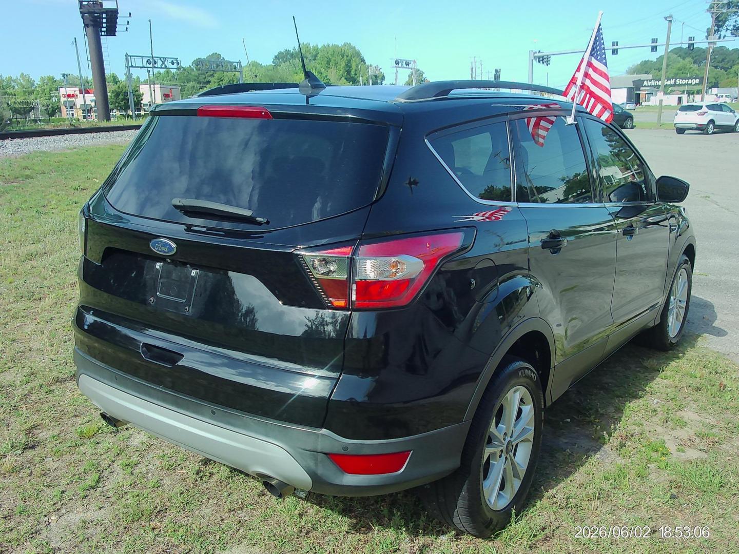 2018 Black Ford Escape SE FWD (1FMCU0GD5JU) with an 1.5L L4 DOHC 16V engine, 6A transmission, located at 2553 Airline Blvd, Portsmouth, VA, 23701, (757) 488-8331, 36.813889, -76.357597 - ***VEHICLE TERMS*** Down Payment: $999 Weekly Payment: $120 APR: 23.9% Repayment Terms: 42 Months *** CALL ELIZABETH SMITH - DIRECTOR OF MARKETING @ 757-488-8331 TO SCHEDULE YOUR APPOINTMENT TODAY AND GET PRE-APPROVED RIGHT OVER THE PHONE*** - Photo#5