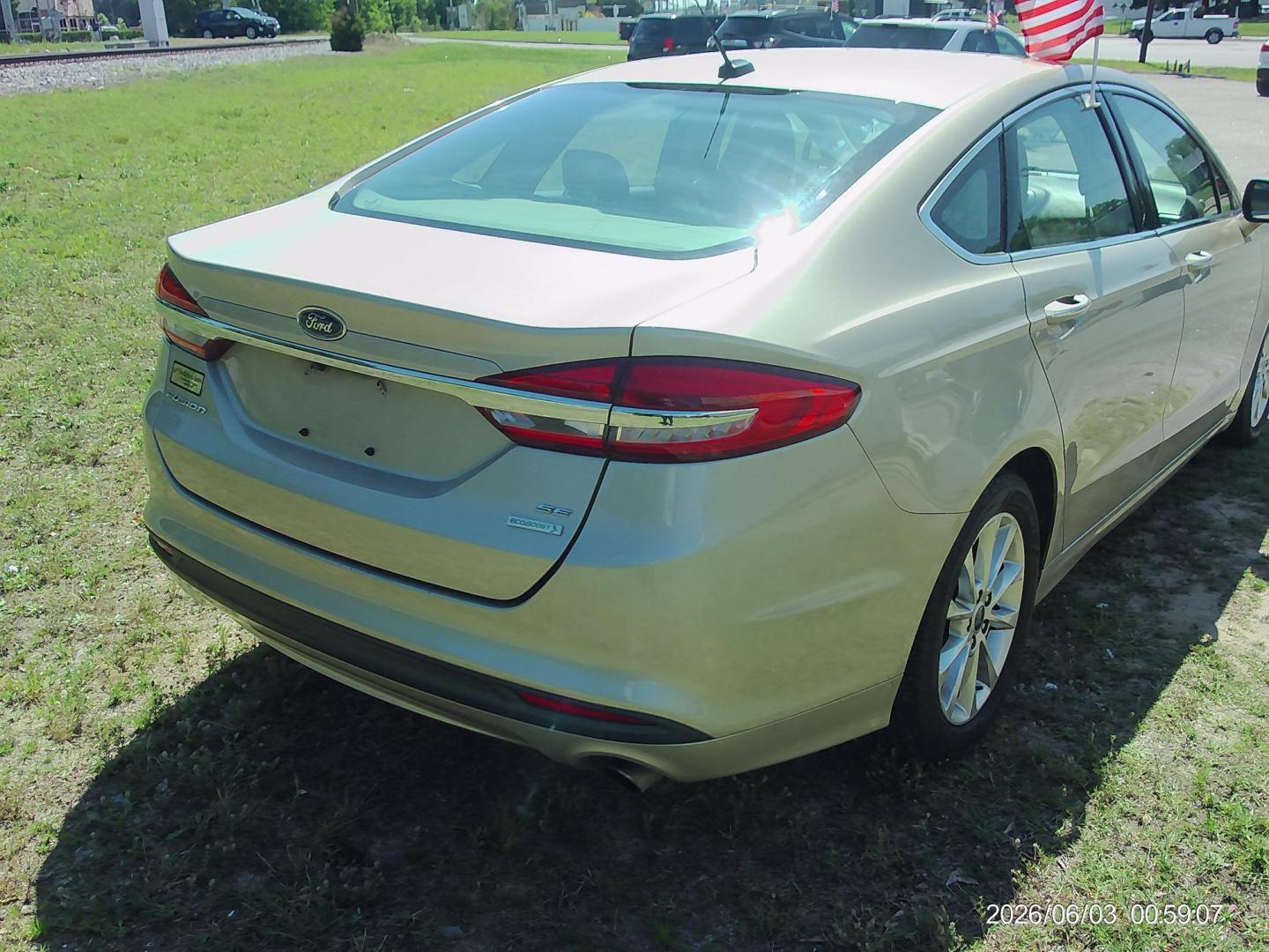 2017 Tan Ford Fusion SE (3FA6P0HD5HR) with an 1.5L L4 DOHC 16V engine, 6A transmission, located at 2553 Airline Blvd, Portsmouth, VA, 23701, (757) 488-8331, 36.813889, -76.357597 - ***VEHICLE TERMS*** Down Payment: $799 Weekly Payment: $105 APR: 23.9% Repayment Terms: 42 Months *** CALL ELIZABETH SMITH - DIRECTOR OF MARKETING @ 757-488-8331 TO SCHEDULE YOUR APPOINTMENT TODAY AND GET PRE-APPROVED RIGHT OVER THE PHONE*** - Photo#5