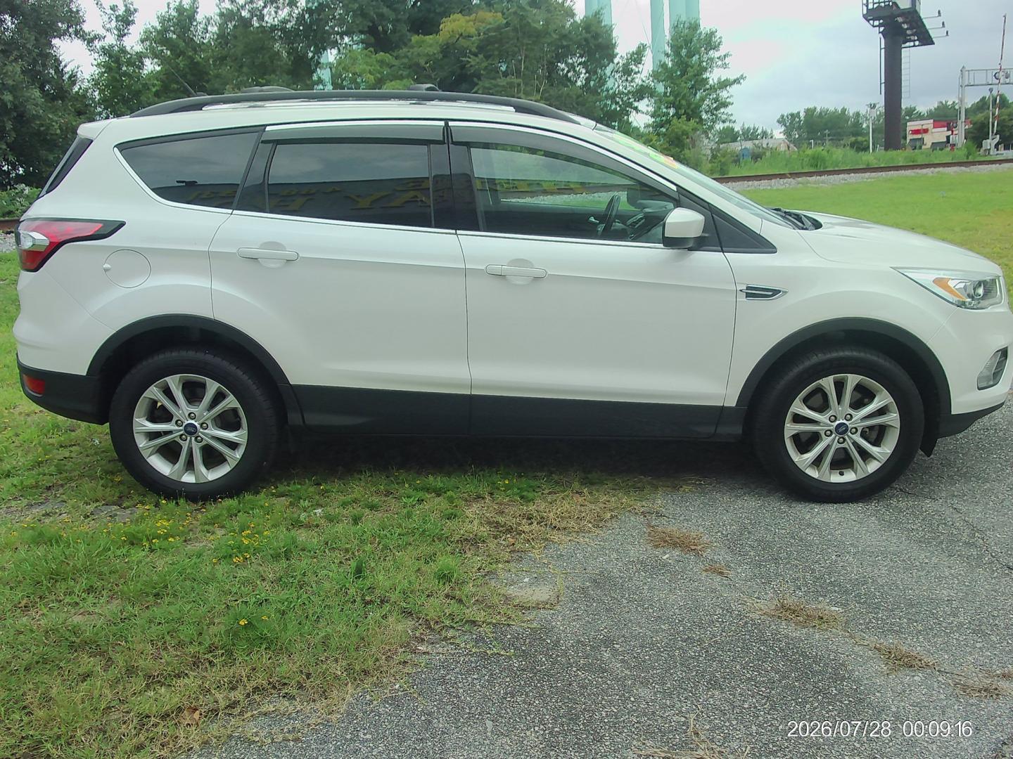 2018 White Ford Escape SEL 4WD (1FMCU9HD4JU) with an 1.5L L4 DOHC 16V engine, 6A transmission, located at 2553 Airline Blvd, Portsmouth, VA, 23701, (757) 488-8331, 36.813889, -76.357597 - ***VEHICLE TERMS*** Down Payment: $1499 Weekly Payment: $125 APR: 23.9% Repayment Terms: 42 Months *** CALL ELIZABETH SMITH - DIRECTOR OF MARKETING @ 757-488-8331 TO SCHEDULE YOUR APPOINTMENT TODAY AND GET PRE-APPROVED RIGHT OVER THE PHONE***- Photo#4
